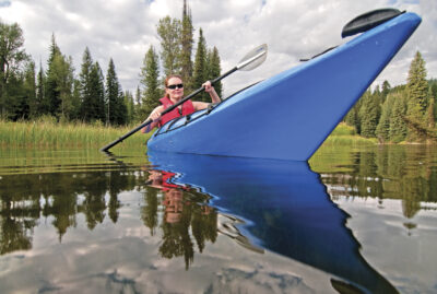 Jamie Brown kayaking on the North Fork of the Payette River near Payette Lake and the city of McCall in the Salmon River Mountains of central Idaho,boating,outdoor recreation,